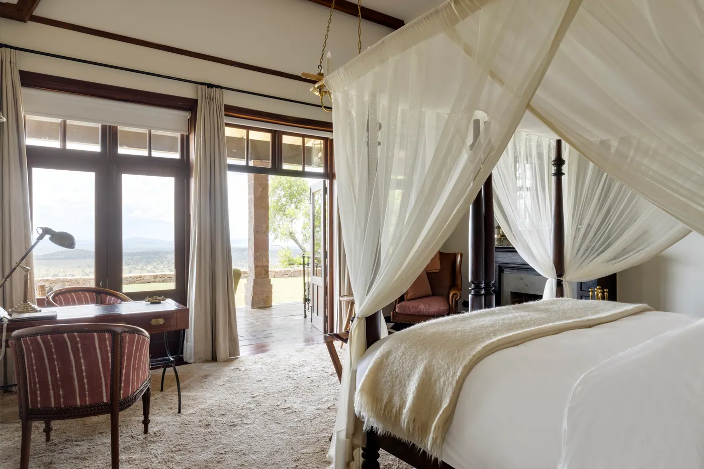 Canopied bedroom opening to the view