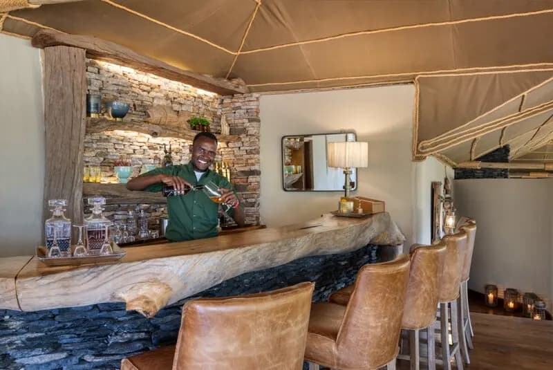 The barman at the stone bar