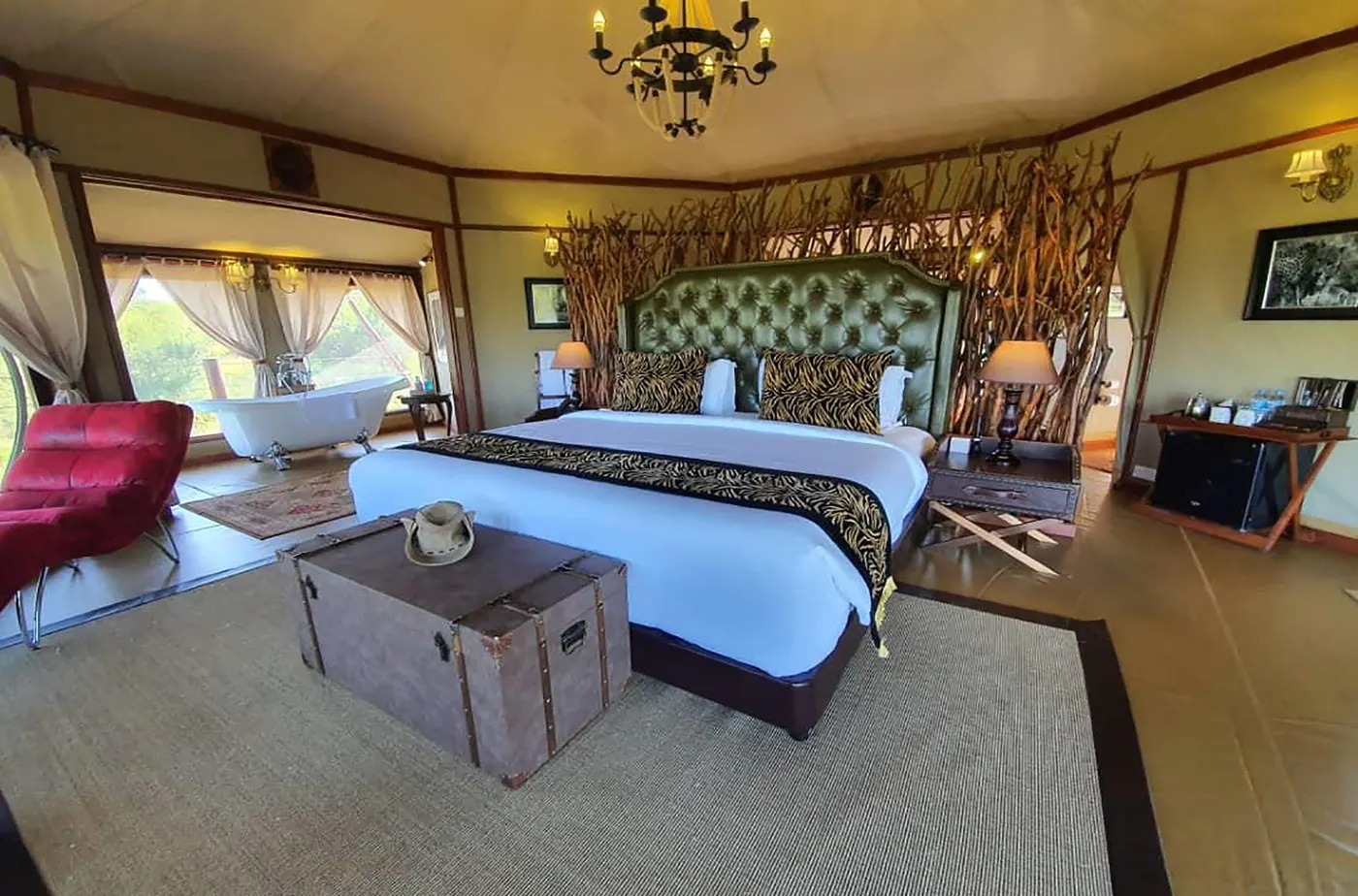 Bed beneath the tent chandelier