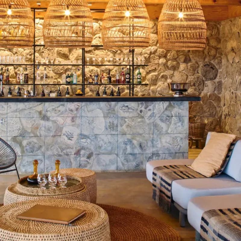 Bar and daybed under woven lights
