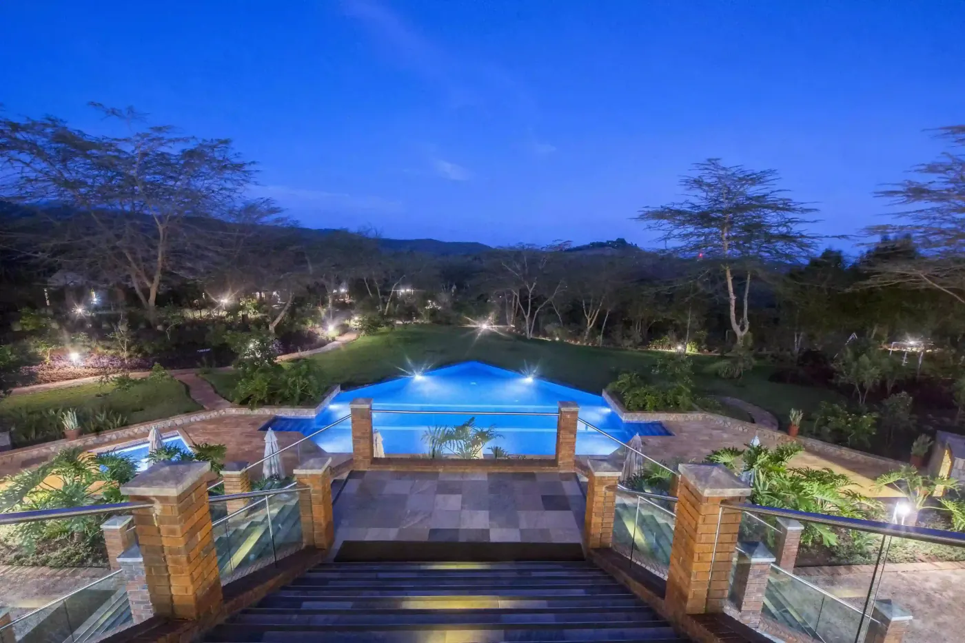The pool lit at dusk