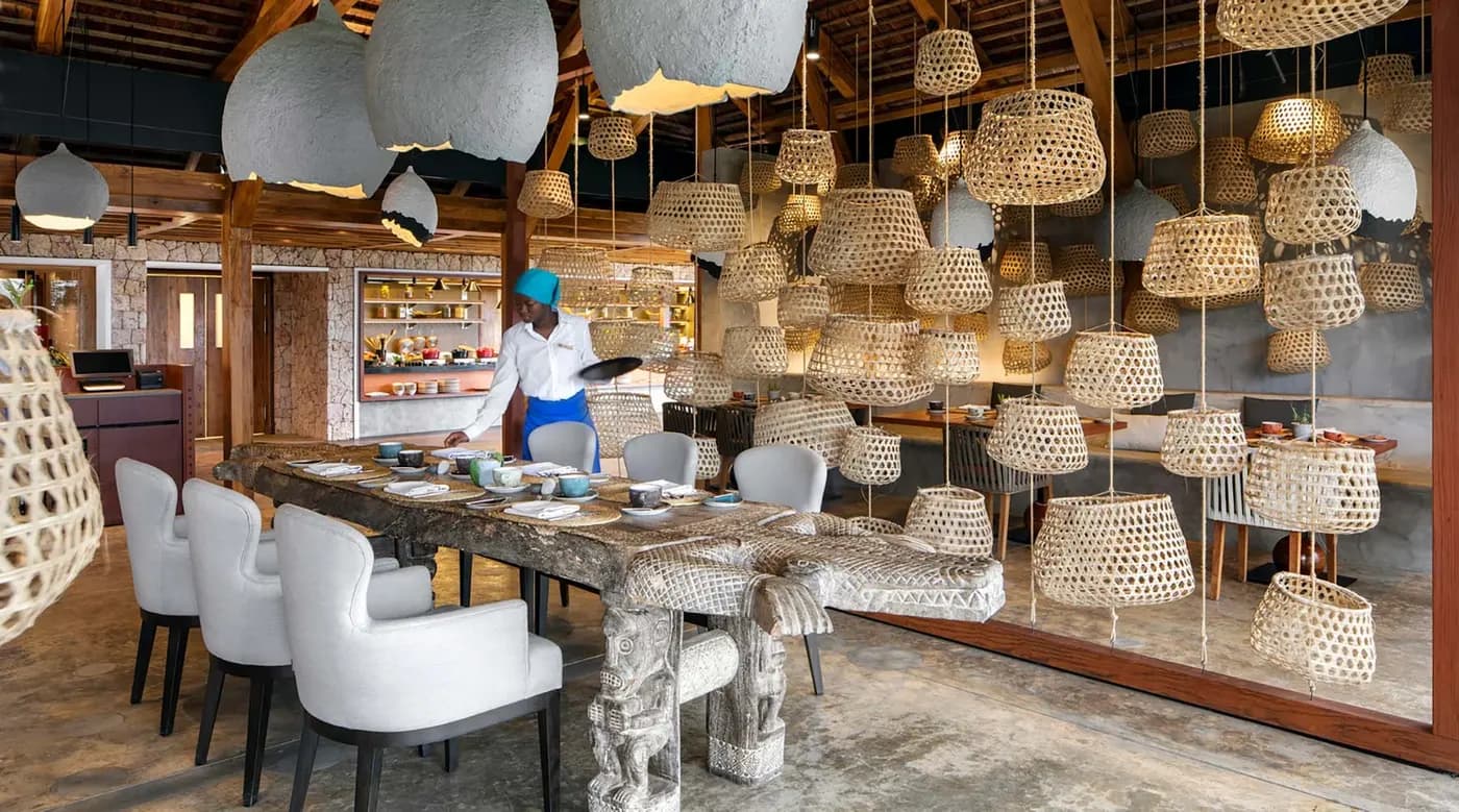 The main restaurant under woven lamps