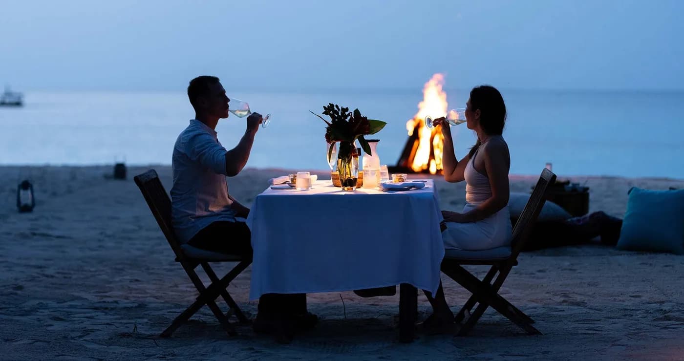 Dinner by a fire on the beach