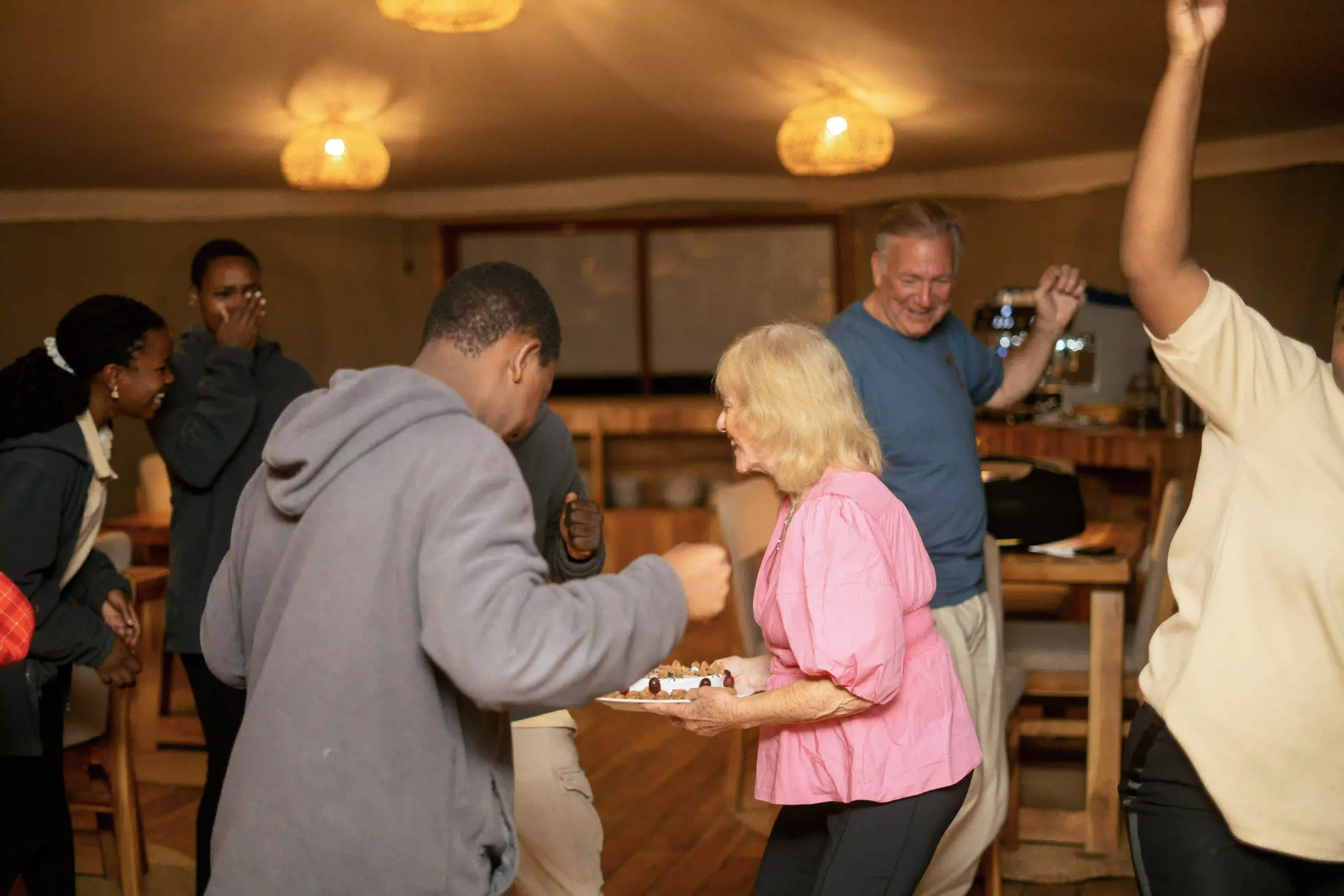 Guests and staff dancing during celebration