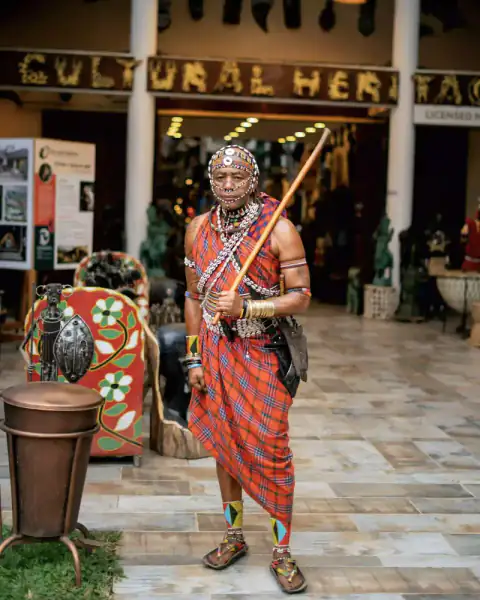 Maasai warrior in traditional dress at market
