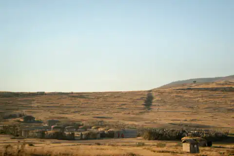 Maasai boma on the hillside at first light
