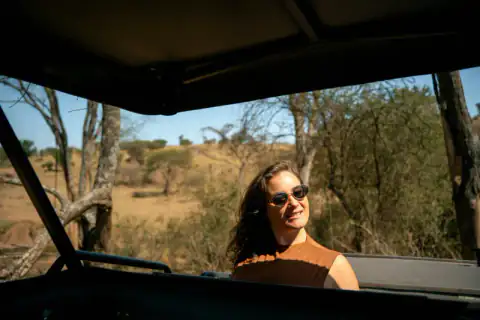 Guest looking out from the open-roof vehicle