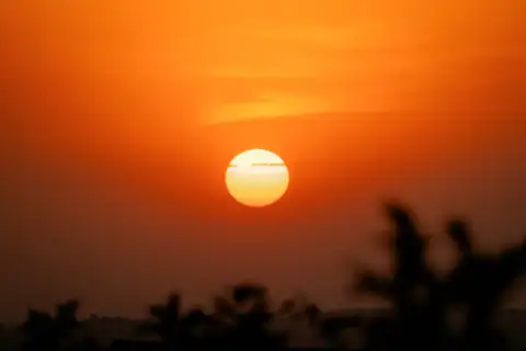 Sun sinking into the dust haze