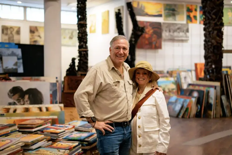 Couple posing inside African art gallery