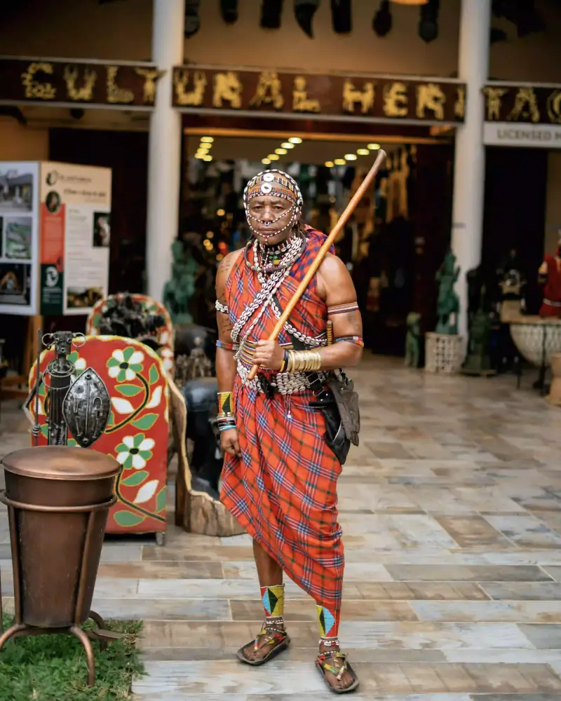 Maasai warrior in traditional dress at market
