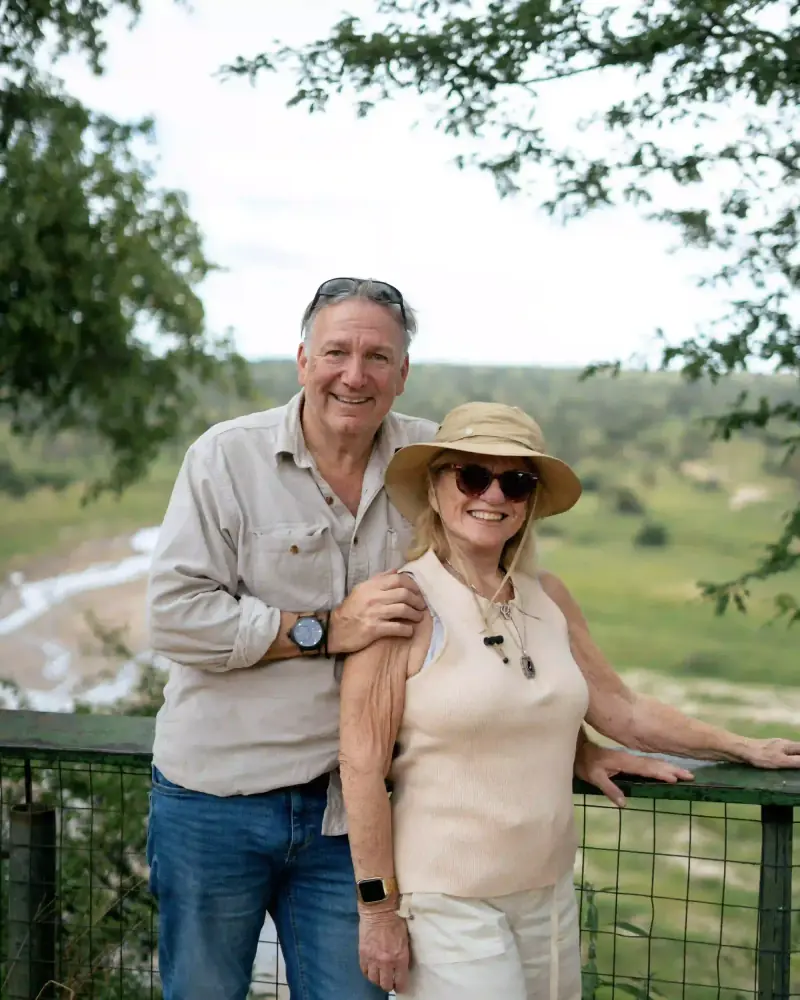Couple at scenic river valley overlook