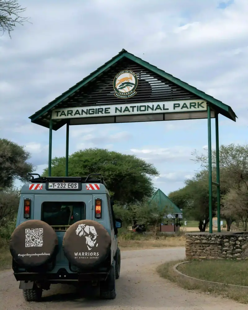 Tarangire National Park entrance gate with vehicle
