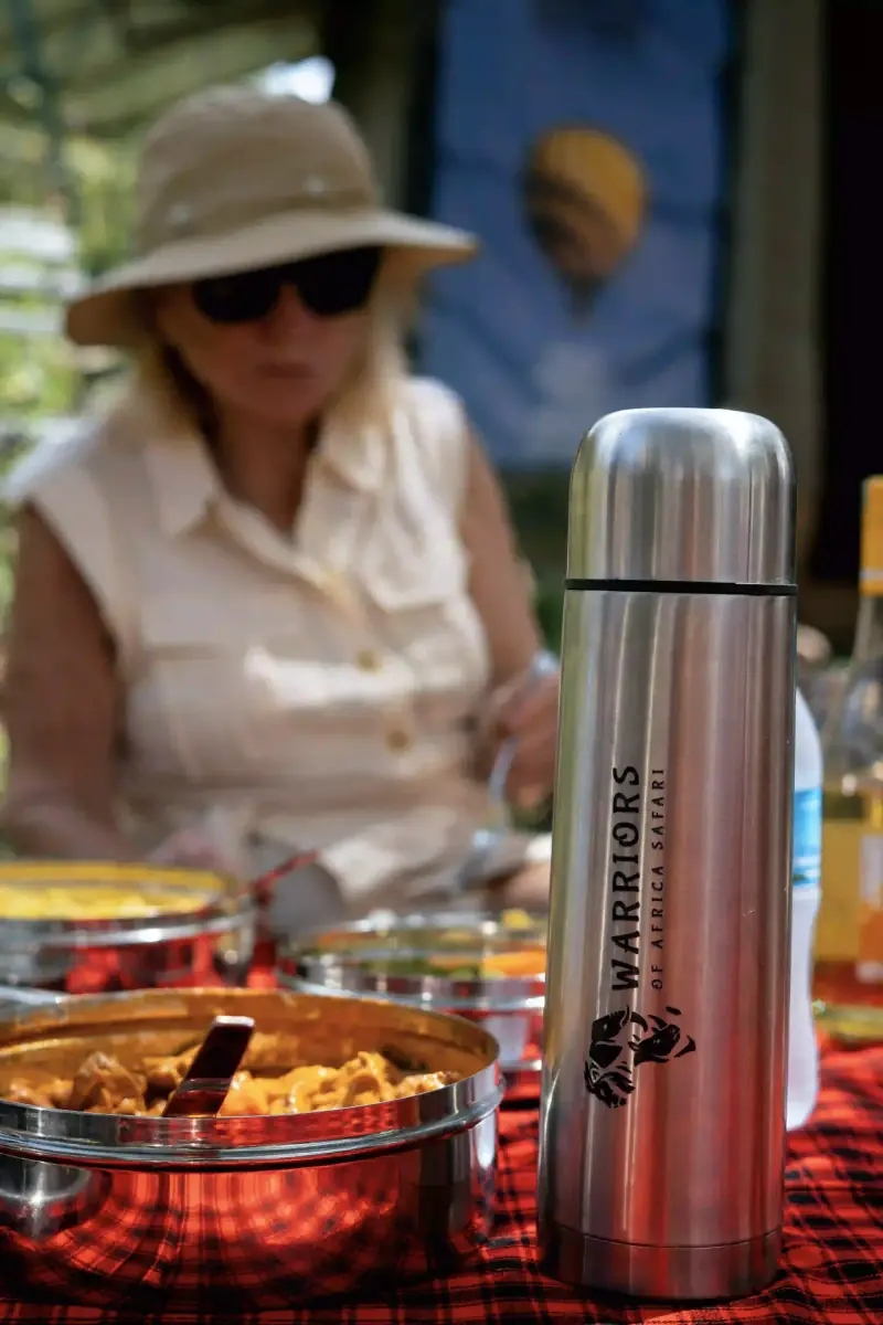 Guest at outdoor bush dining table