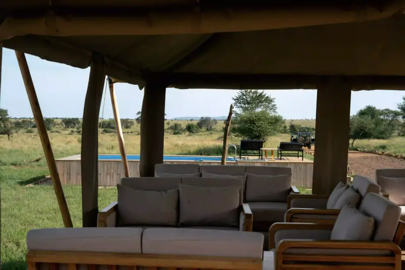 Lodge lounge and tented camp with pool view