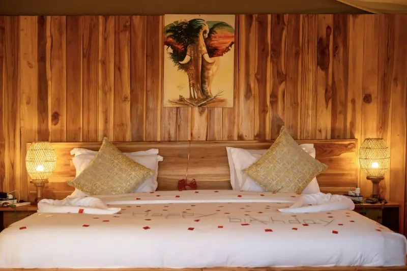 Tented suite bed decorated for a birthday