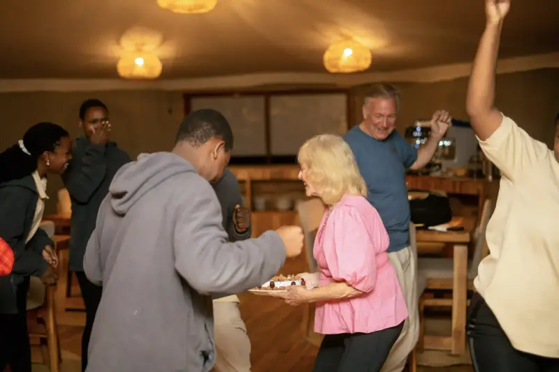 Guests and staff dancing during celebration