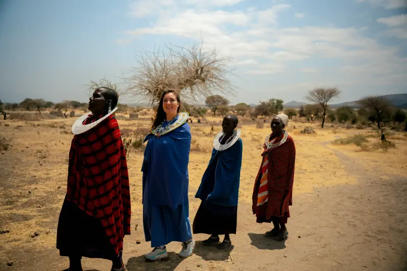 Walking with Maasai hosts across the village clearing