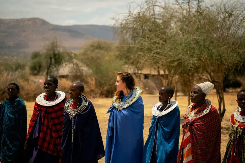 Guest among Maasai women in beaded collars