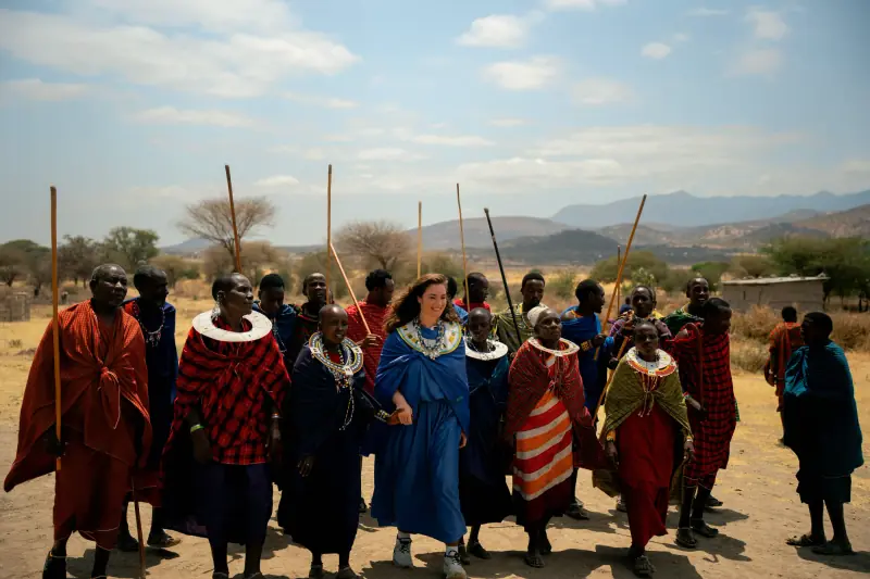 Guest surrounded by singing Maasai warriors