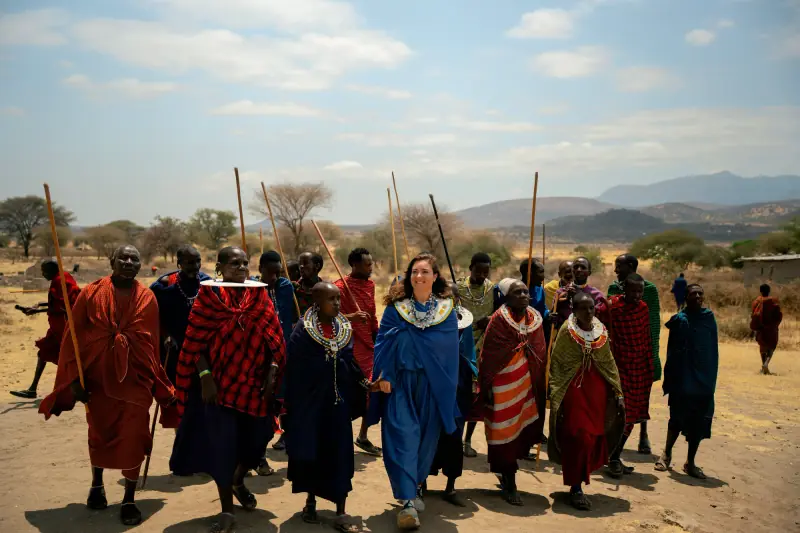 Village procession walking out toward the plains