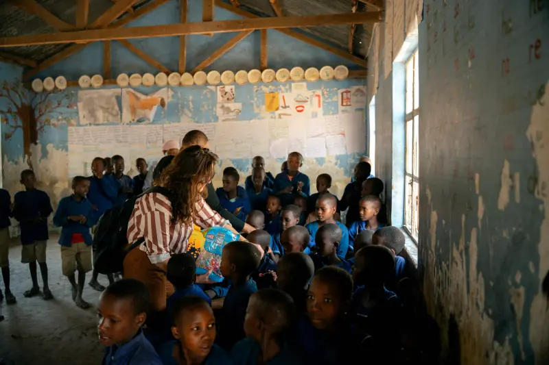 Schoolchildren in uniform crowding the classroom