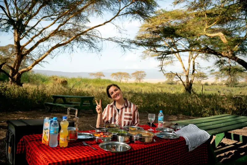 Picnic lunch laid out under an acacia