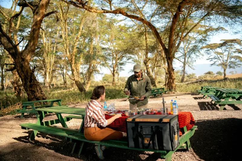 Guest and guide at a crater picnic site