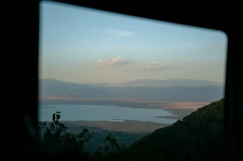 Crater lake framed by the safari vehicle window