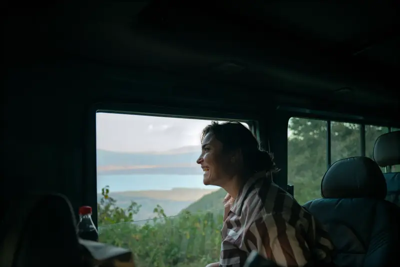 Guest smiling at the crater view from her seat