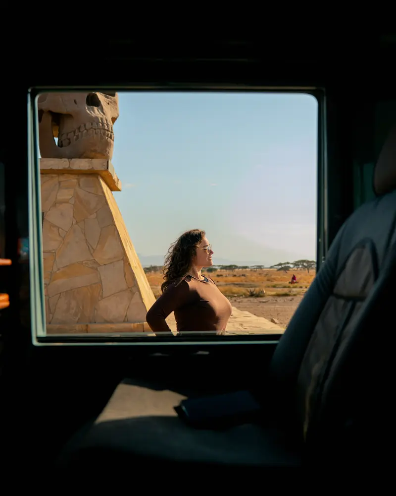 Guest framed in the vehicle window at the park gate