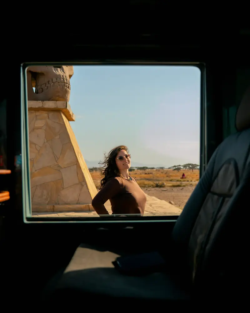Guest framed in the vehicle window at the park gate
