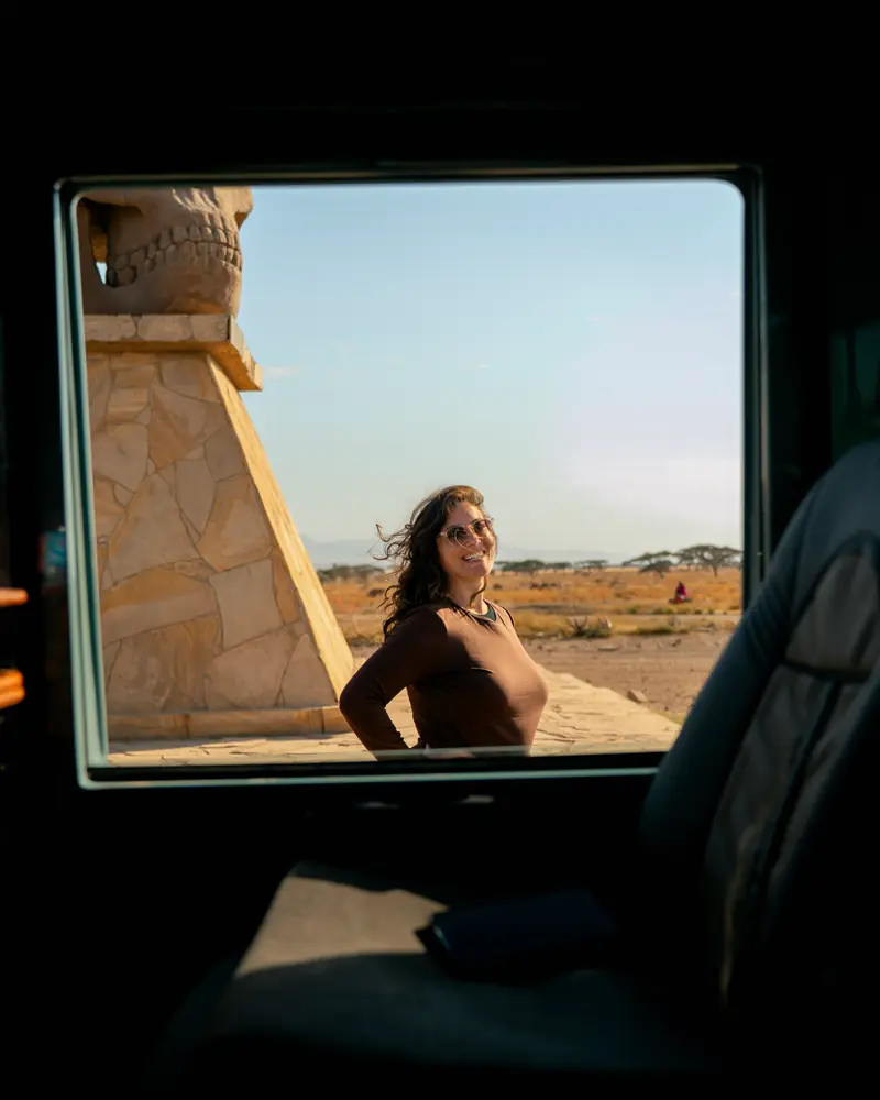 Guest laughing in the window frame at the park gate