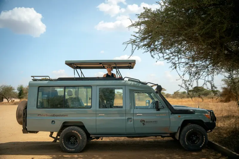 Warriors of Africa safari vehicle with the roof hatch open
