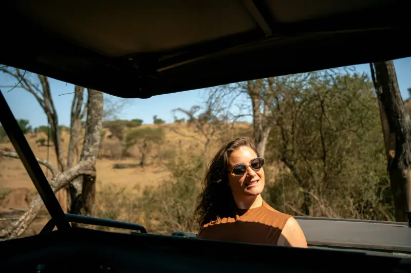 Guest looking out from the open-roof vehicle