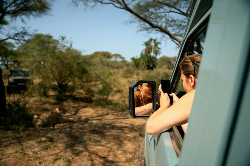 Guest photographing from the vehicle window