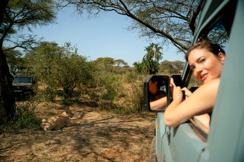 Guest smiling from the vehicle window