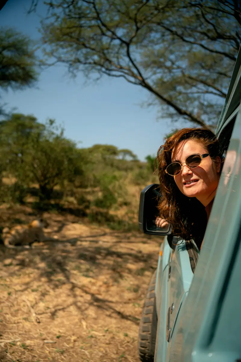 Guest looking out from the safari vehicle