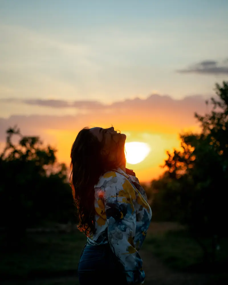 Head tipped back to the setting sun