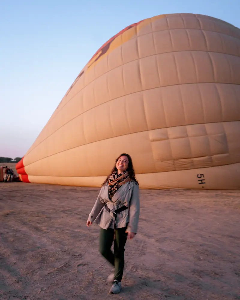 Guest in front of the balloon envelope at dawn