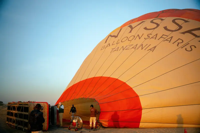 Ground crew inflating the balloon before dawn