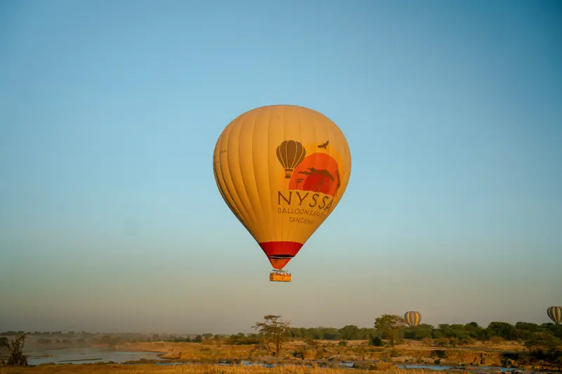 Balloon climbing over the Serengeti at dawn