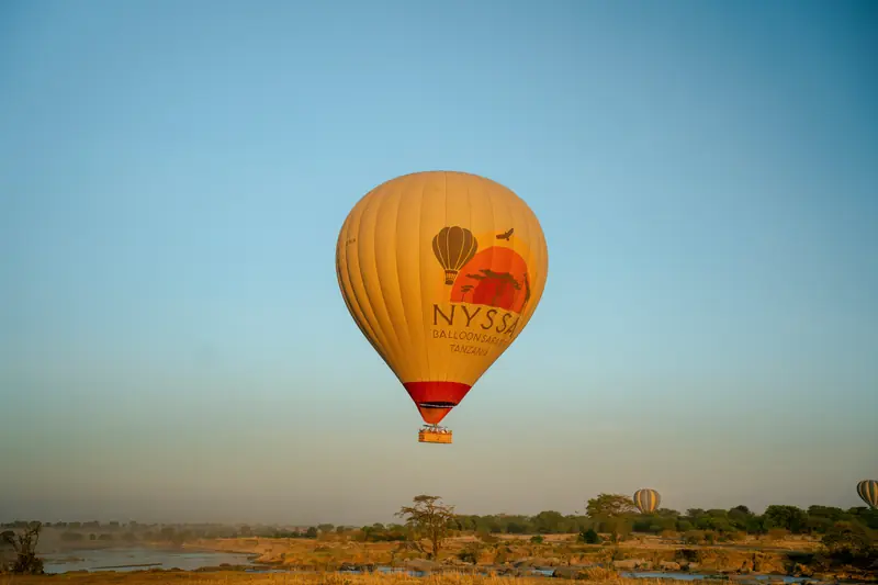 Balloon drifting above the morning plains