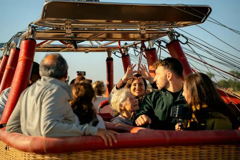 Passengers looking out from the balloon in flight