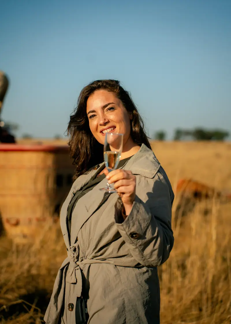 Guest raising a glass after her balloon flight