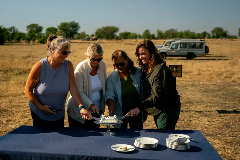 Cutting a celebration cake out on the plains
