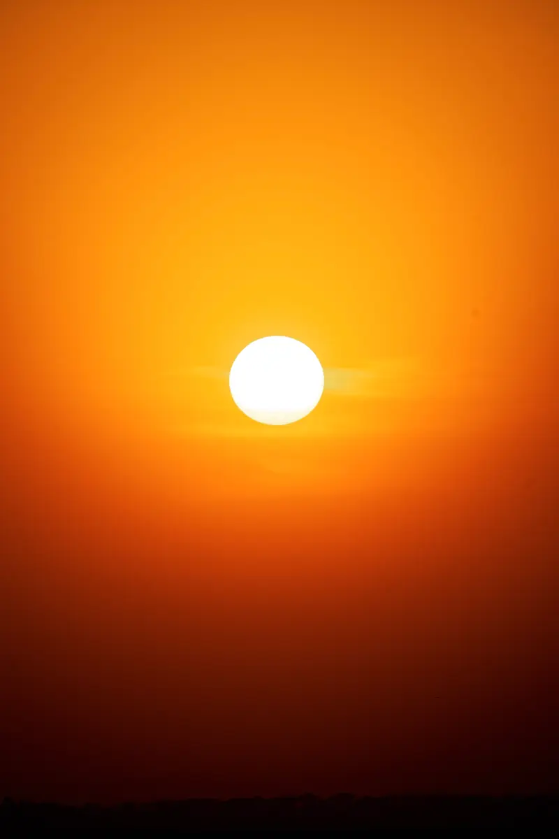Sun dropping through the evening haze
