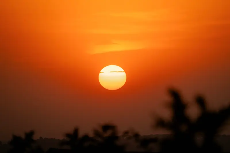 Sun sinking into the dust haze