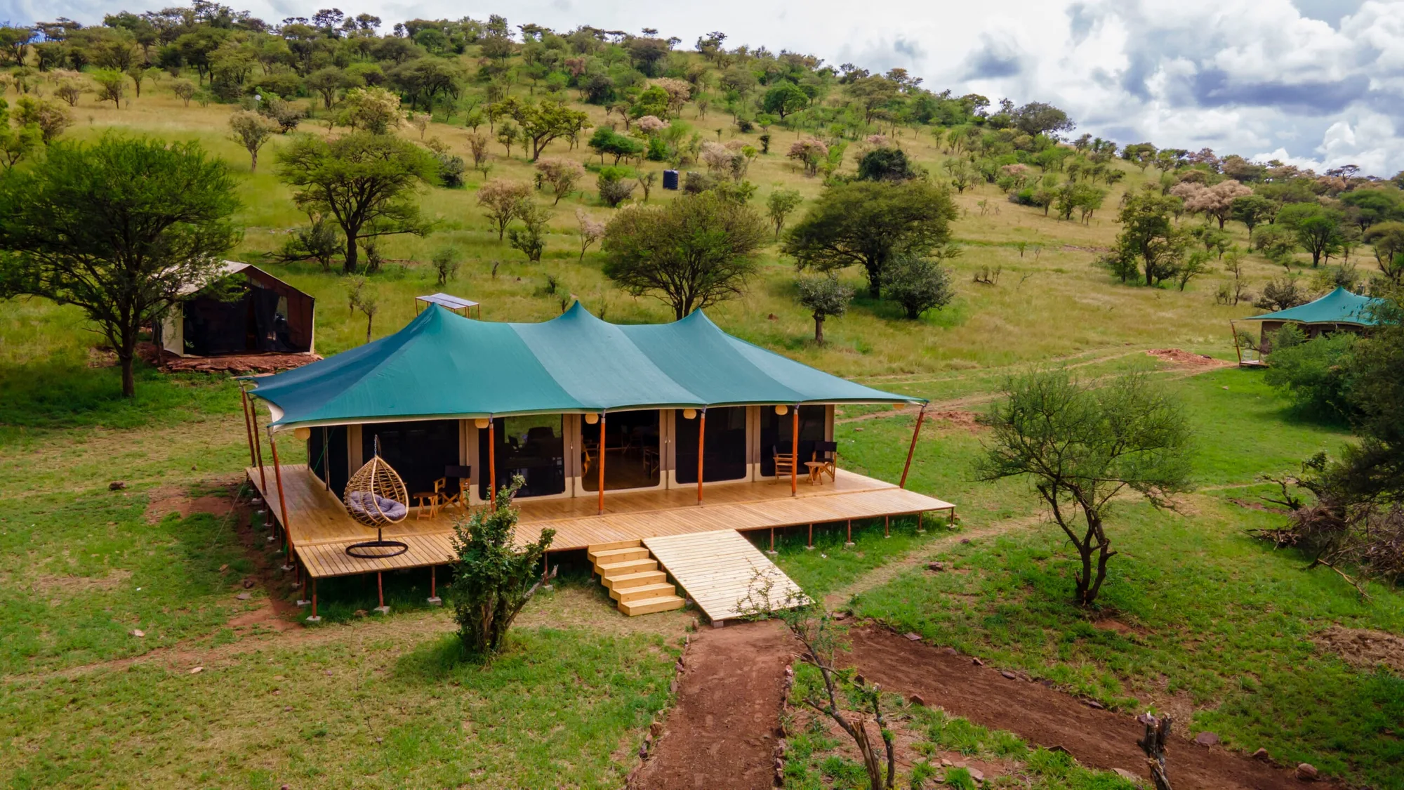 Main tent and deck in the green bush