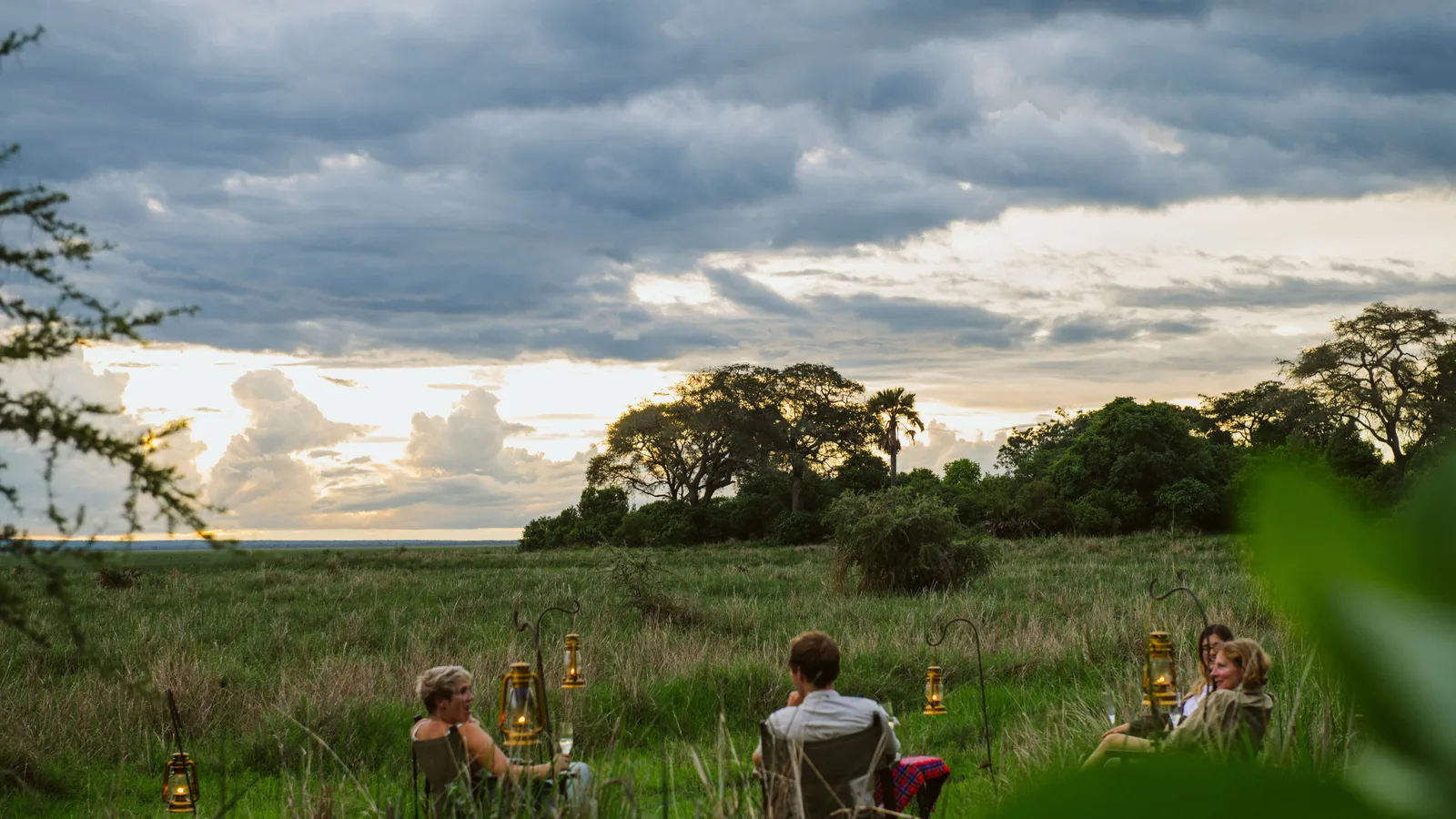 Guests looking out over the Katisunga Plain in Katavi under a dramatic sky